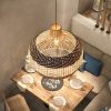 Black-White-Rattan-Pendant-Light-Over-Dining-Table-Top-View