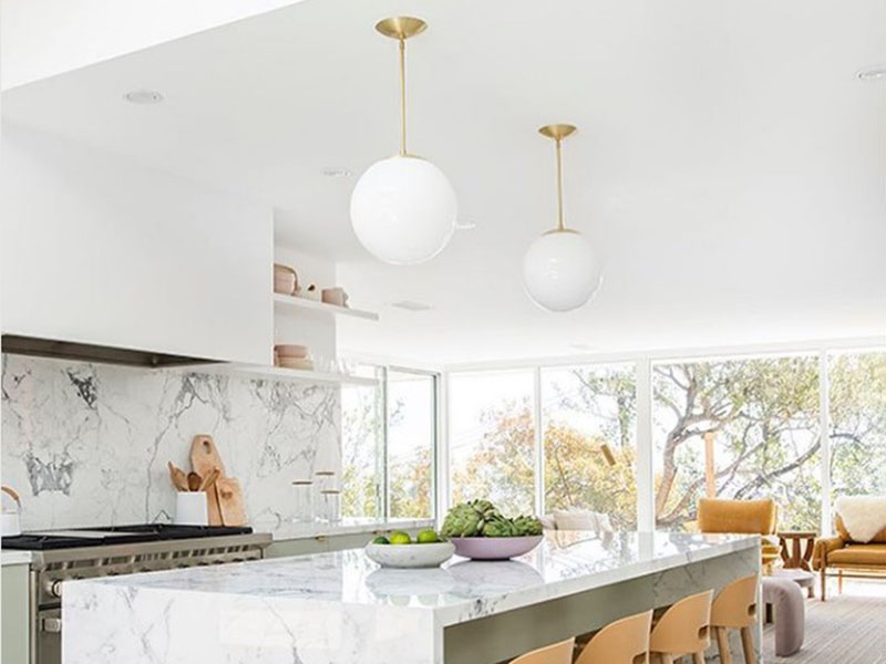 Two Oversized Globe Pendant Over Kitchen Island