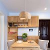 Asymmetric Wabi Sabi Rattan Pendant Light Over Dining Table