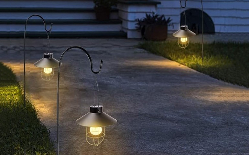 Solar Lights Hanging On Shepherd’s Hooks