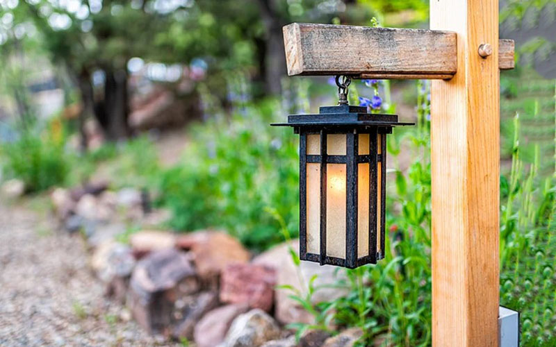 Wooden Lamp Posts On Both Sides Of The Entrance And Walkway