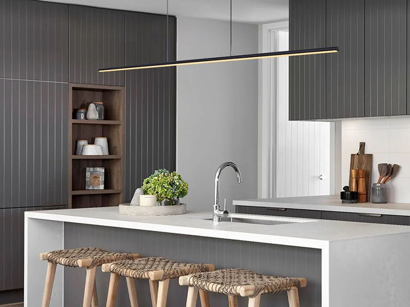 Minimalist Linear Pendants Over Kitchen Bar