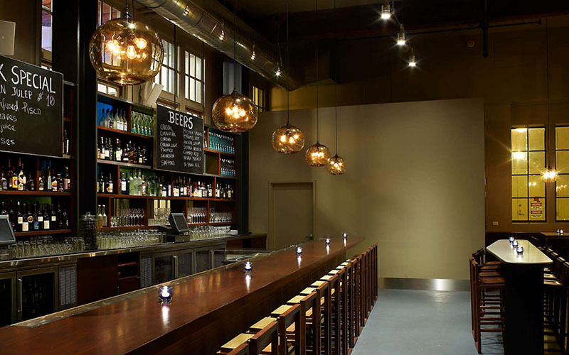 Pendant Lights Floating At The Perfect Height Above A Long Bar