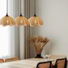 3 Rattan Flora Pendant Lights Over Dining Table