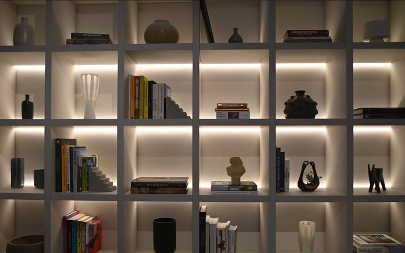 Backlit Bookshelves Create A Cozy, Library-inspired Look