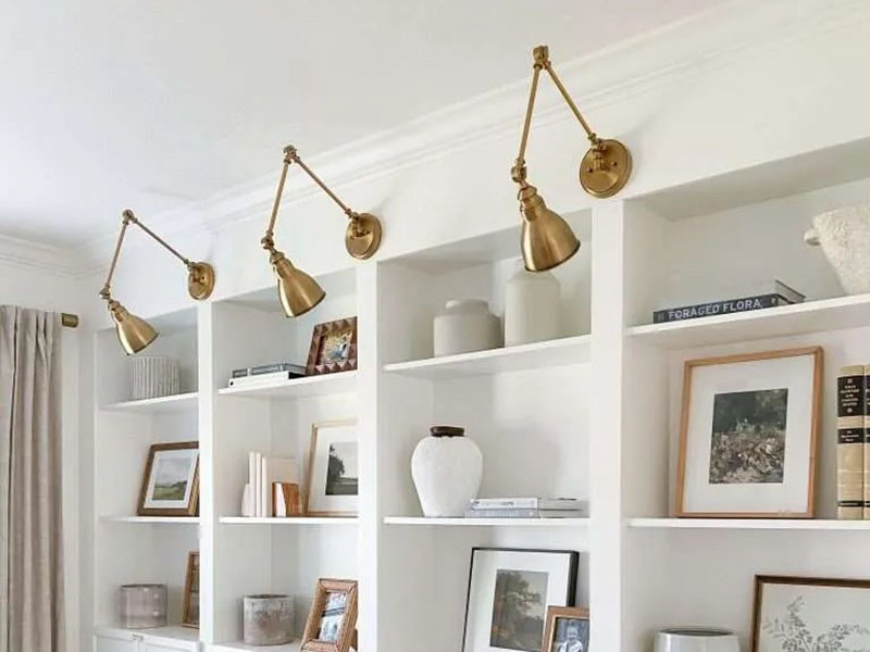 Wall Sconce Above A Livingroom Bookshelf