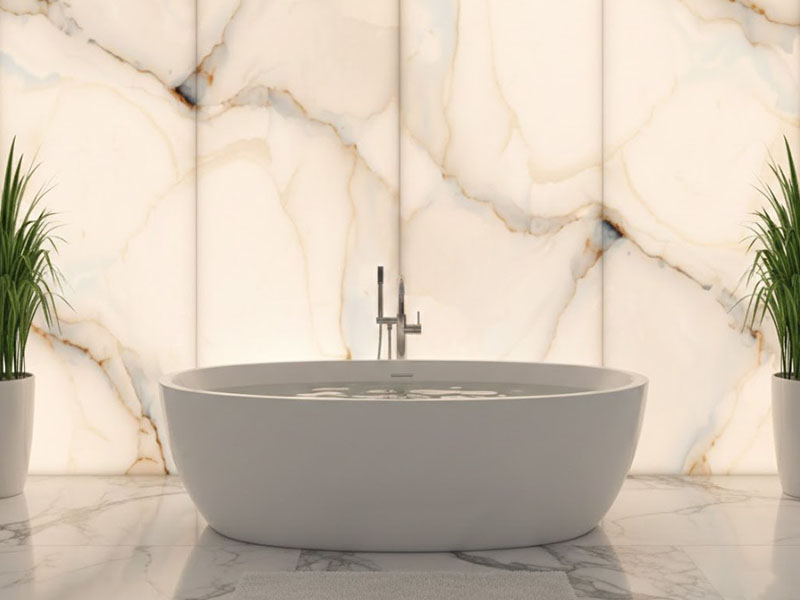 Backlit Onyx Wall Panels Behind Freestanding Bathtub