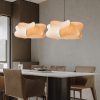 Silk Cocoon Pendant Light cluster above dining table