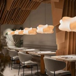 Silk Cocoon Pendant Lights lined up in restaurant setting