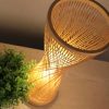 Handwoven Bamboo Table Lamp Wicker Light Fixture Tilted Angle Closeup