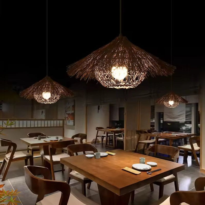 Wicker Straw Hat Pendant Light Hanging Over Restaurant Dining Table