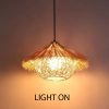 Wicker Straw Hat Pendant Light On Warm Glow Rattan Lamp Closeup