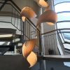 Cascading Wood Shell Shape Wooden Chandeliers in Open Stairwell