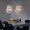 White Geometric Pendant Lights Over Dining Table